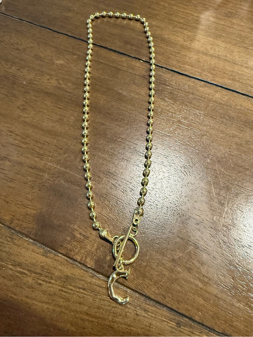 Gold Beaded Toggle Necklace with 'C' Initial Charm